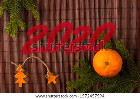 New Year Concept postcard. Christmas decorations hand made from tangerine peel and fir-tree branches and lettering