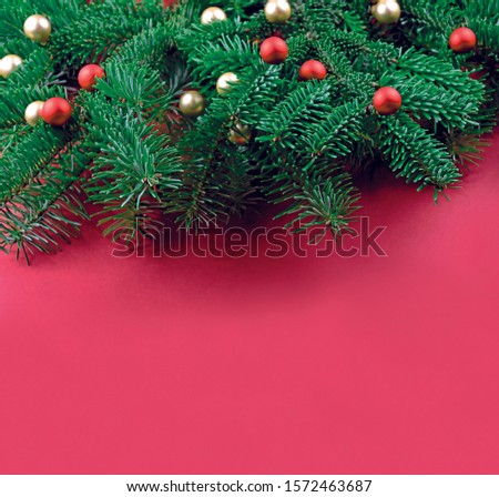Christmas red frame stock images. Christmas decorations balls on tree branch stock images. Christmas tree branch on a red background. Beautiful natural Christmas background