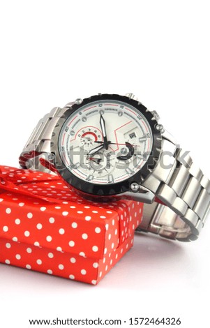Men's wrist metal watch on white background with gift box