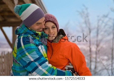 Mid adult couple embracing in snow