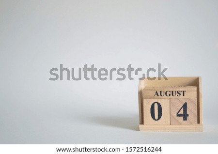 Empty white background with number cube on the table, August 4.