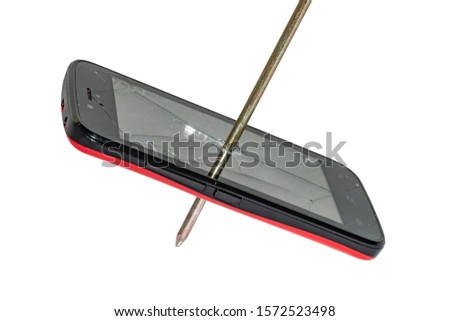 smartphone pierced by a big nail. broken phone. cracks on the screen. isoleted
