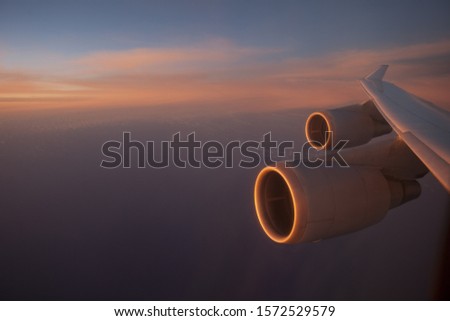 View of engine and wing on commercial airplane