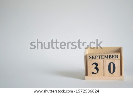Empty white background with number cube on the table, September 30.