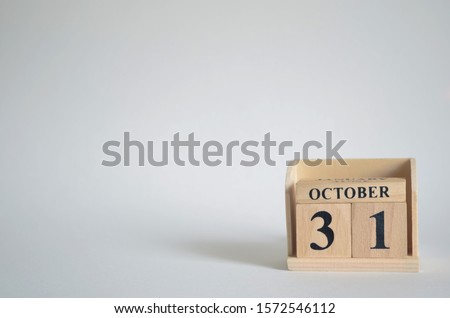 Empty white background with number cube on the table, October 31.