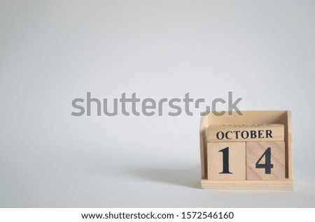 Empty white background with number cube on the table, October 14.