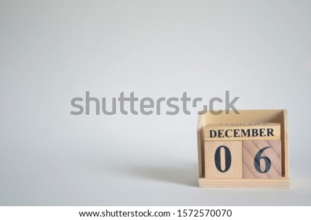 Empty white background with number cube on the table, December 6.