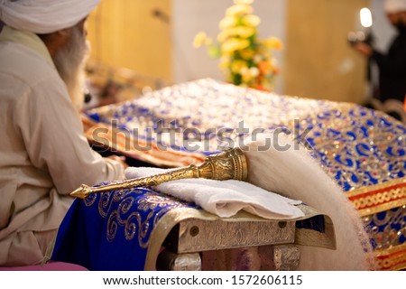  Chaur sahib for Guru Granth sahib. Sikh Religion Chaur sahib in Gurudwara sahib.  Royalty-Free Stock Photo #1572606115
