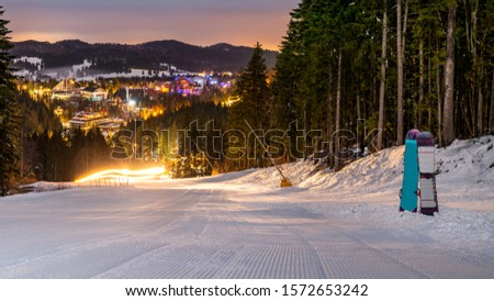 Ski slope in Poiana Brasov winter resort, Romania. Dark scenery. Night long exposure. Ski slope in Poiana Brasov winter resort, Romania. Dark scenery. Night