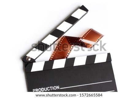 Movie clapper board isolated with filmstrip 