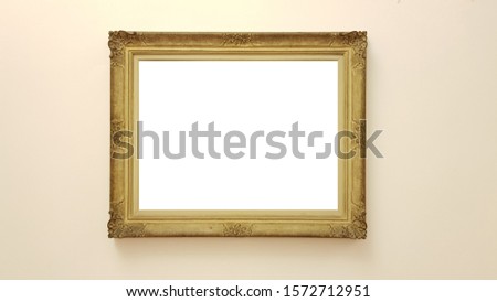Empty Golden Frame On Beige Wall.White Blank Advertisement Banner Mock Up Isolated Template