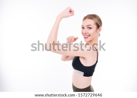 Young beautiful girl goes in for sports on white background