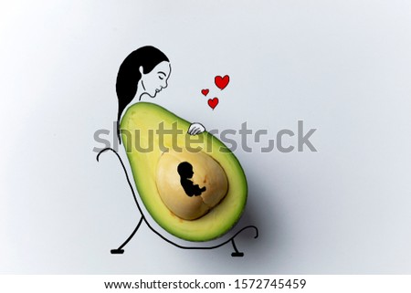 illustration of pregnant woman and avocado photo