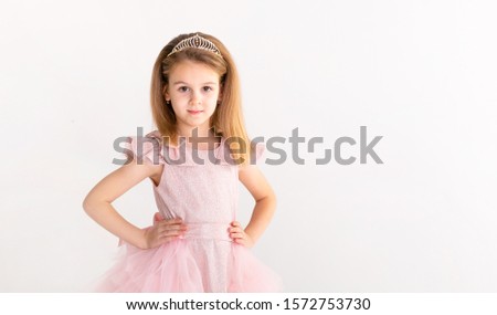 Beautiful little princess dancing in luxury dress