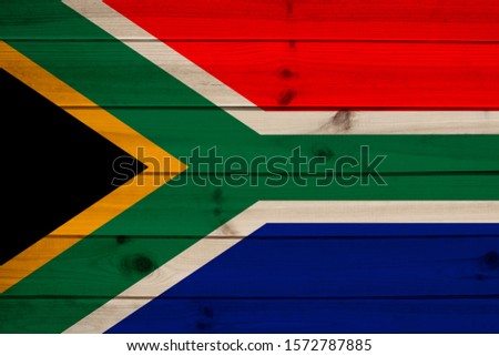 photo of the beautiful colored national flag of the state of South Africa, concept of tourism, economy and politics, closeup