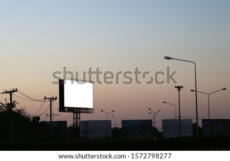 Blank billboard silhouette at sunset for advertisement