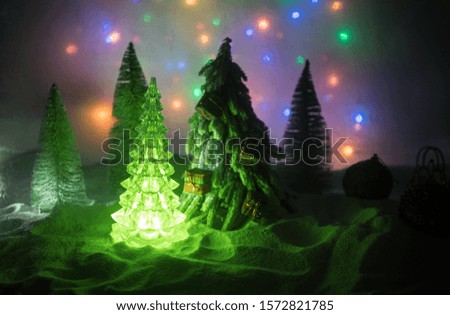 Winter holidays concept. Christmas background with baubles, on snow, free space for text. Christmas decoration. Festive background. Empty space for text