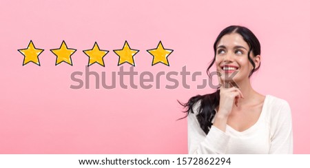 Five star rating with young woman in thoughtful pose