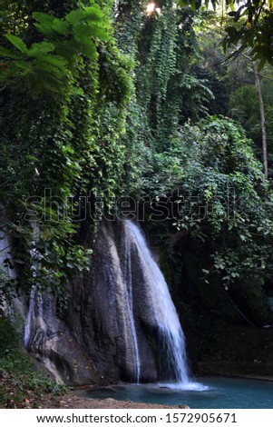 A beautiful water fall with green trees is named Num-tok  Ka-sa  (in Thai words ) in Mae Sot, Tak, Thailand.