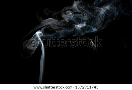 Smoke trail at black background