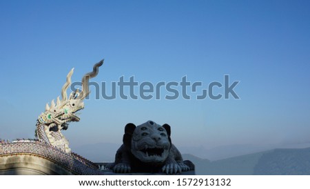 Image of serpent with monster name's See Hoo Ha Ta.In lagend of Bhuddha story inThailand. Royalty-Free Stock Photo #1572913132