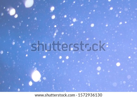 Winter background with snowflakes, stars and falling snow