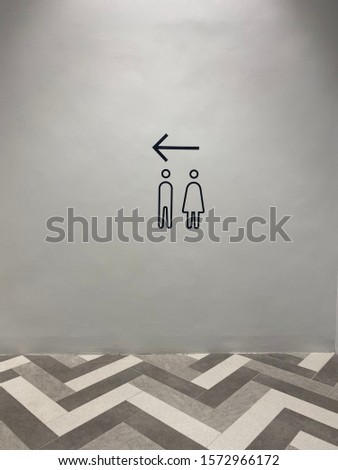 Scenery background of the direction sign symbol of gender for toilet on the wall