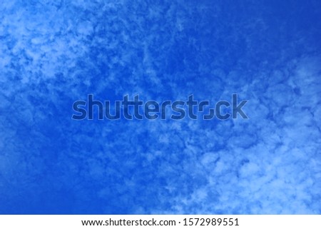 Natural clouds, wonderful patterns. A deep blue sky with thin clouds and layers. The sky with clouds like water waves separation.