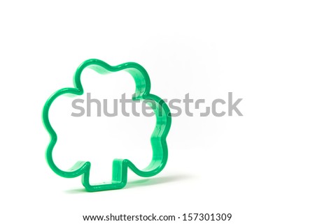 Four leaf clover shape on white facing to the right