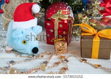 Christmas rat with gifts. Symbol of 2020. Selective focus. The concept of celebrating Christmas and New year.