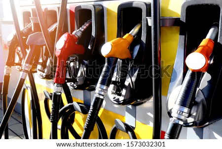 red and yellow colorful fuel, gasoline dispenser Royalty-Free Stock Photo #1573032301