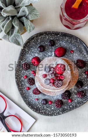 Pancakes with blackberries, raspberries and red currants. American cuisine. Dessert. Recipes Breakfast
