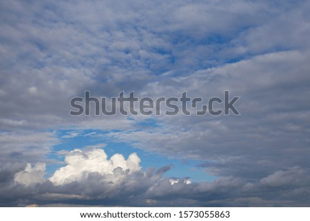 White textured clouds on azure sky, contrasting summer natural background