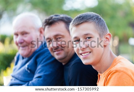 Male generations - grandfather, son and grandson. Royalty-Free Stock Photo #157305992