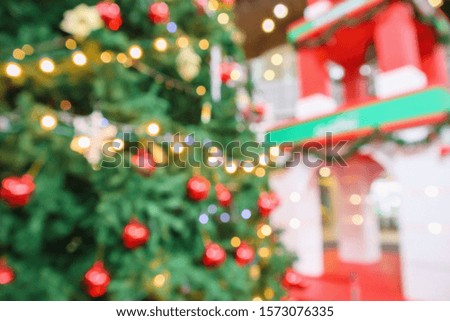 Abstract christmas holiday with festive gold bokeh light on tree blurred background