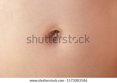 navel with skin of asian kid Royalty-Free Stock Photo #1573083586