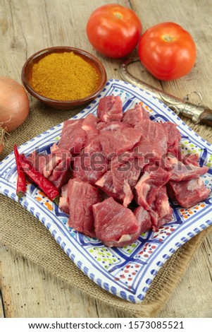 raw lamb meat on a wooden table