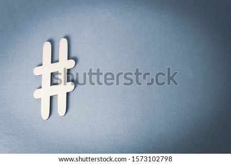 hashtag on metallic gray background, vignetting image toning, copy space