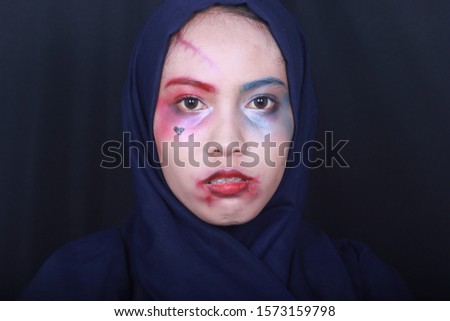 Asian Muslim woman with a scary makeup