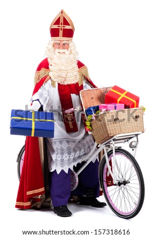 Sinterklaas on a bike, going to bring presents to the children