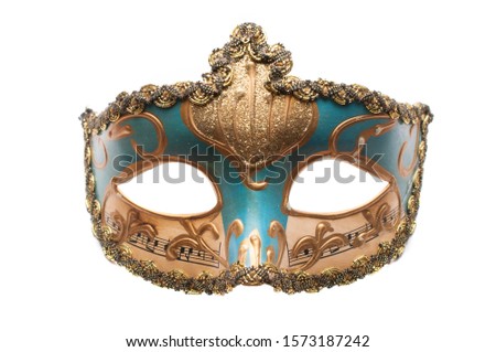 Blue venetian theatre mask with musical notes and gold decorations isolated on white background
