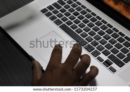 Indian Asian man using a laptop