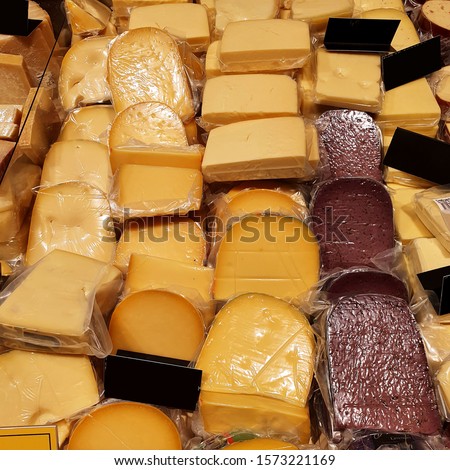 Macro Photo food cheese. Texture background fresh big yellow cheese. Product Image cheese in market