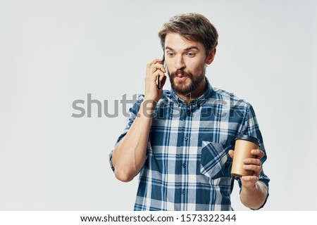 Handsome man cup of coffee and mobile phones