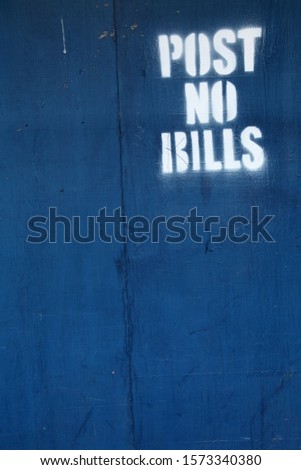 post no bills message in order to keep the wooden wall clean