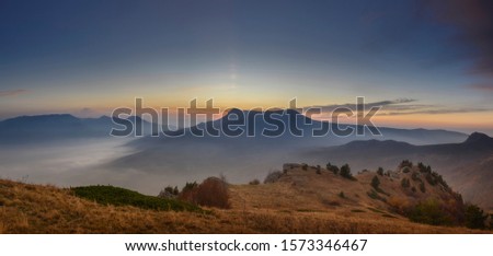 Beautiful sunset in the mountains. Scenic view. Horizontal panorama for travel layouts
