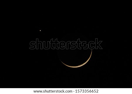 Close-up Moon 4.4% close jupiter planet in dark sky background, real time taken on 6.35 pm., November 28, 2019. Royalty-Free Stock Photo #1573356652