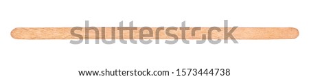 wooden stirrer coffee stick on an isolated white background Royalty-Free Stock Photo #1573444738