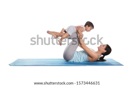 Young woman doing exercise with her son isolated on white. Time for fitness Royalty-Free Stock Photo #1573446631