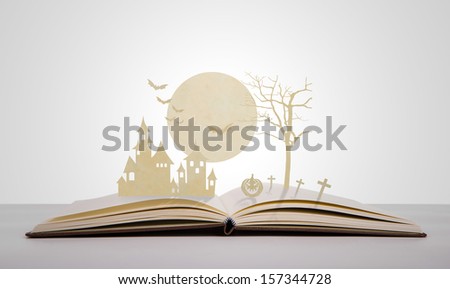 Paper cut of halloween on old book